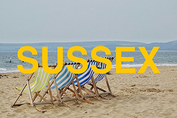 A picture of a sandy beach, representing the Sussex coast with the label Sussex over the top